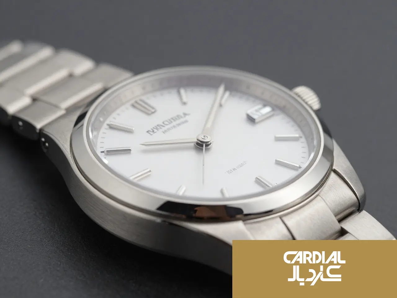 English: Closeup macro of a luxury Cardial stainless steel watch with a white dial and sapphire crystal